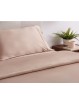 Detalle de almohadones y saco del juego de funda nórdica de seda de bambú Nature en color beige.